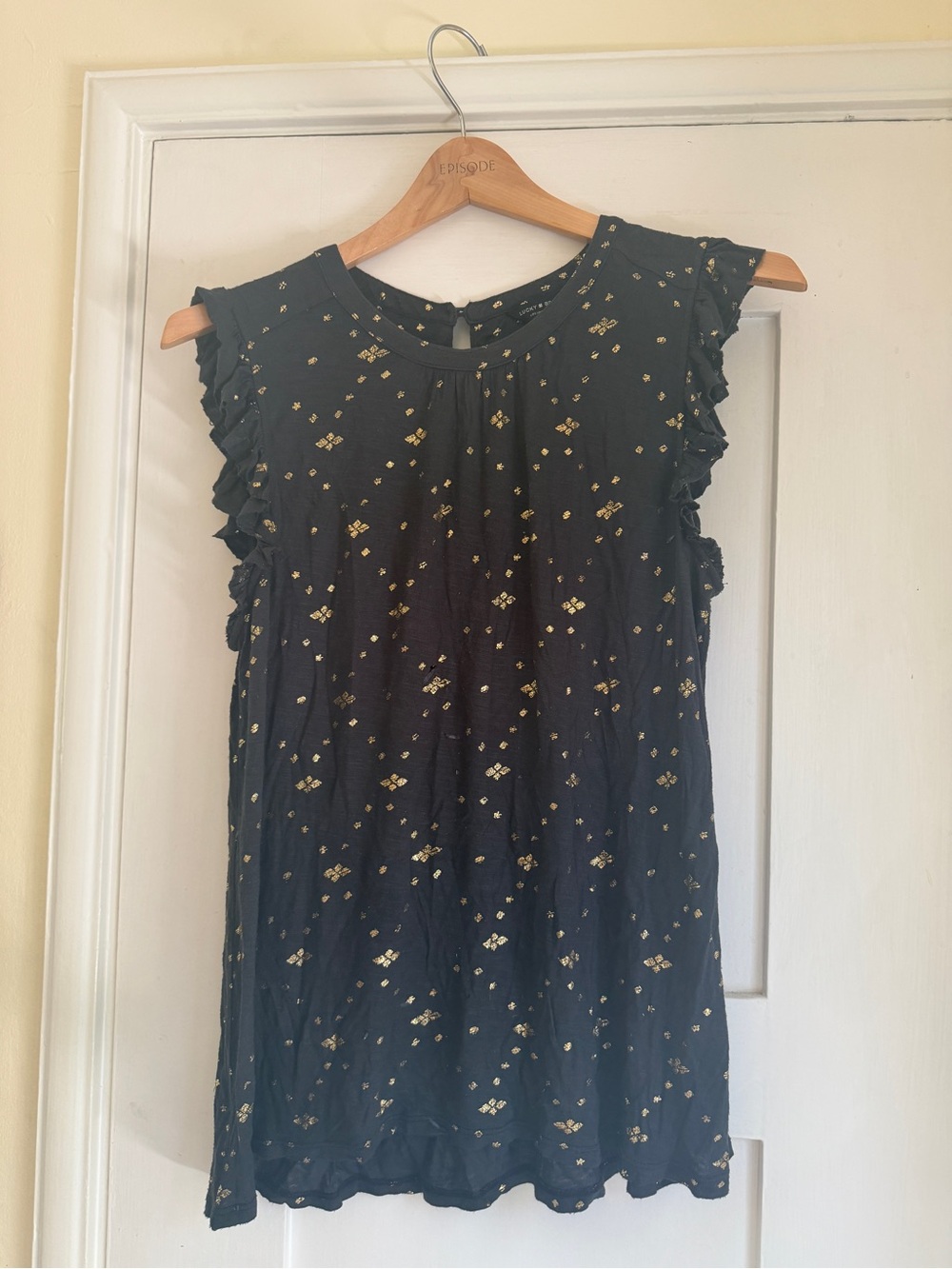 Lucky Women’s Black Sleeveless Ruffle Top with Metallic Gold Print